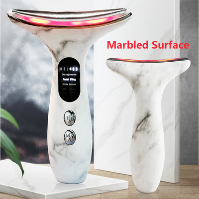 ป้องกันการแก่ตัวและกําจัดริ้วรอย เครื่องนวดคอไฟฟ้า เครื่องนวดใบหน้า LED สําหรับคอใบหน้า